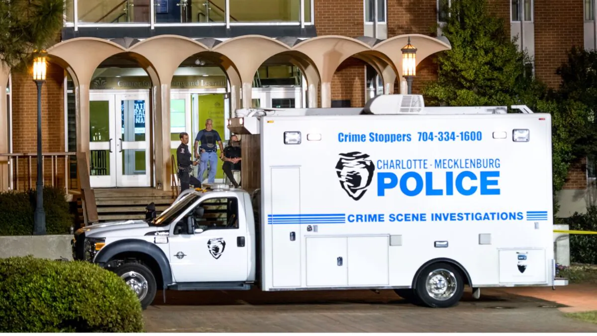 Charlotte-Mecklenburg law enforcement stand in front front of the Kennedy building in a file photo taken in Charlotte, North Carolina. (Photo by Sean Rayford/Getty Images)