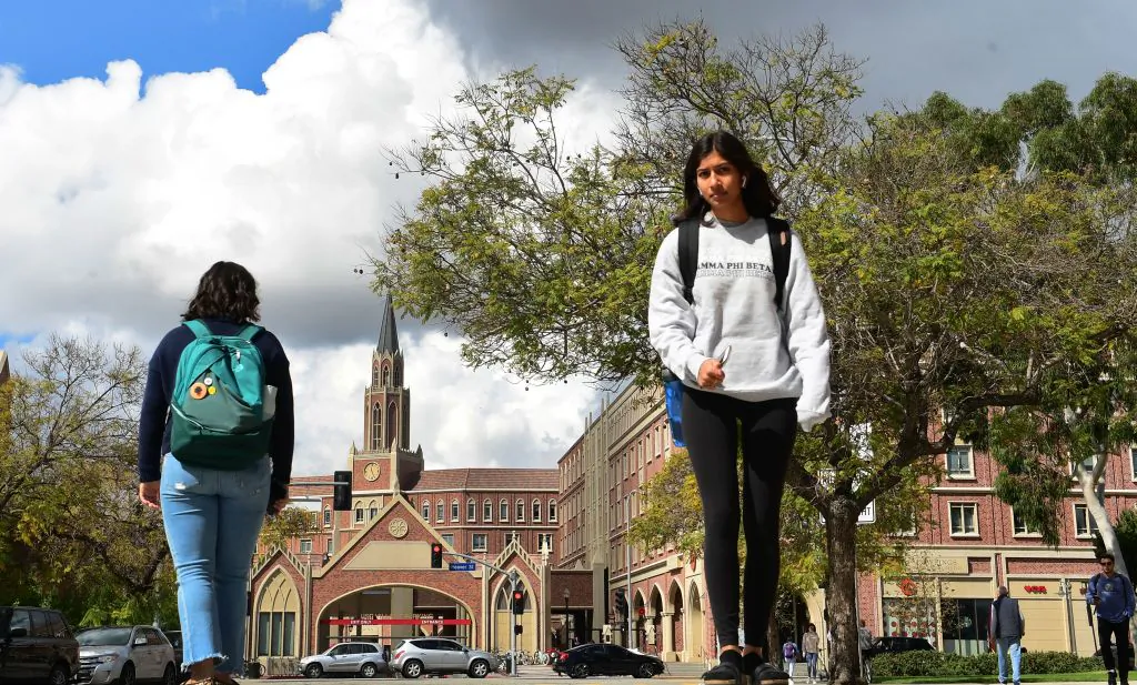 Students walk on the campus at the University of Southern California in Los Angeles on March 11, 2020. (Frederic J. Brown/AFP via Getty Images)