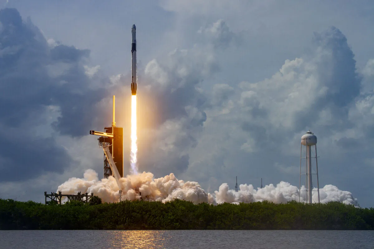 A Falcon 9 rocket carrying two astronauts launches at the Kennedy Space Center, Cape Canaveral, Fla., on May 30, 2020. (SpaceX via Getty Images)