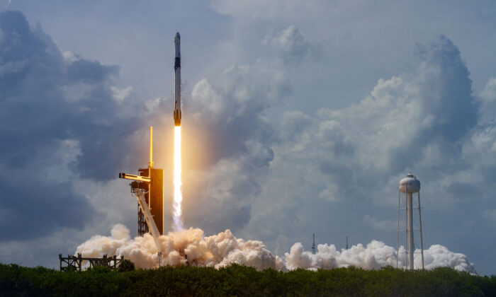 A Falcon 9 rocket carrying two astronauts launches at the Kennedy Space Center, Cape Canaveral, Fla., on May 30, 2020. (SpaceX via Getty Images)