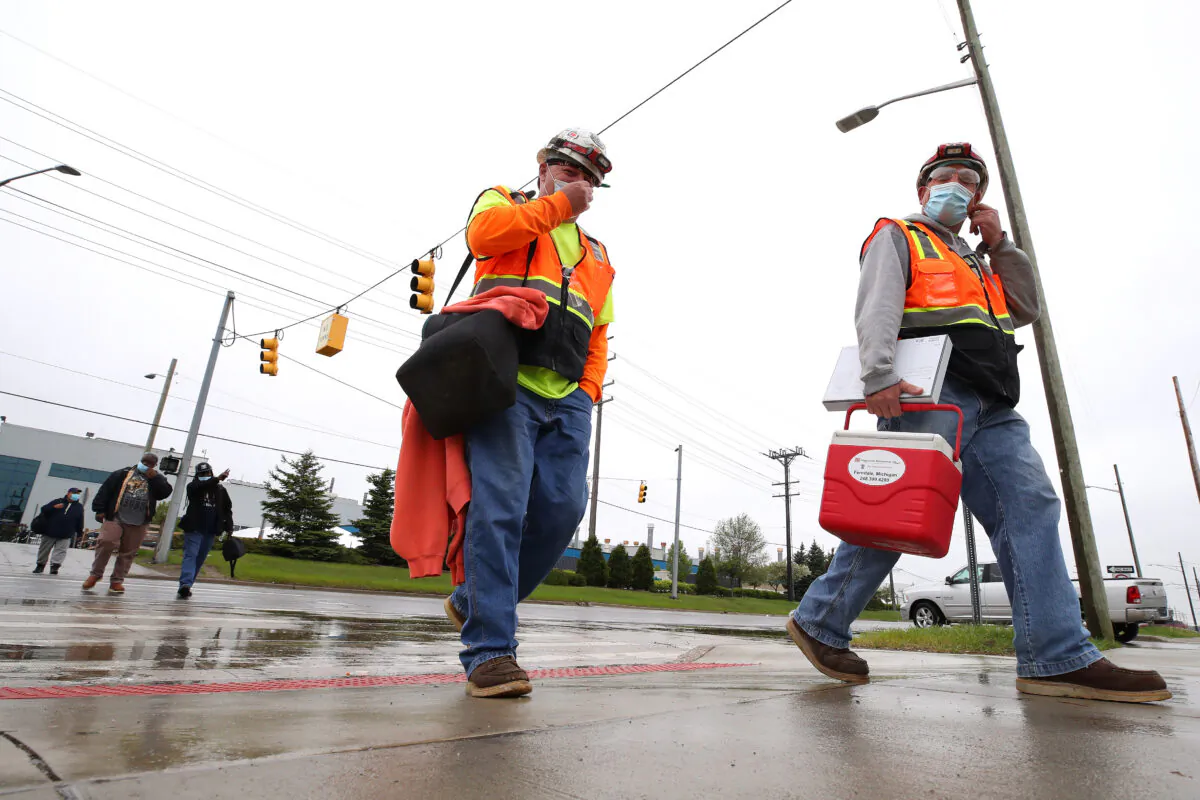 United Auto Workers members leave the Fiat Chrysler Automobiles Warren Truck Plant in Warren, Mich., on May 18, 2020. (Gregory Shamus/Getty Images)