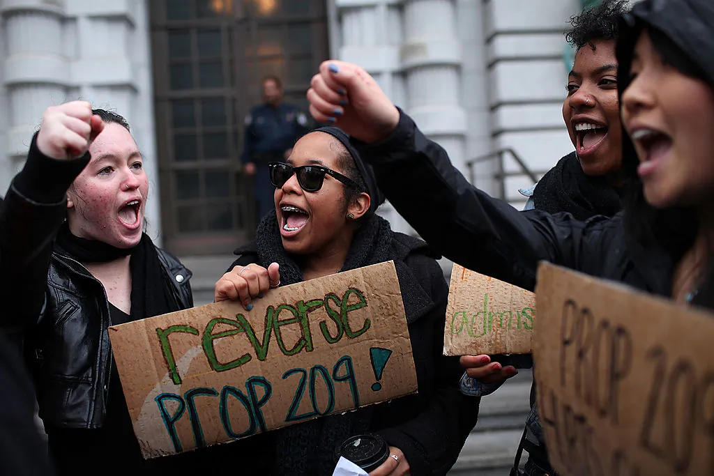 Students hoping for a repeal of California's Proposition 209, which banned affirmative action, hold signs outside of the Ninth U.S. Circuit Court of Appeals in San Francisco, Calif., on Feb. 13, 2012. (Justin Sullivan/Getty Images)