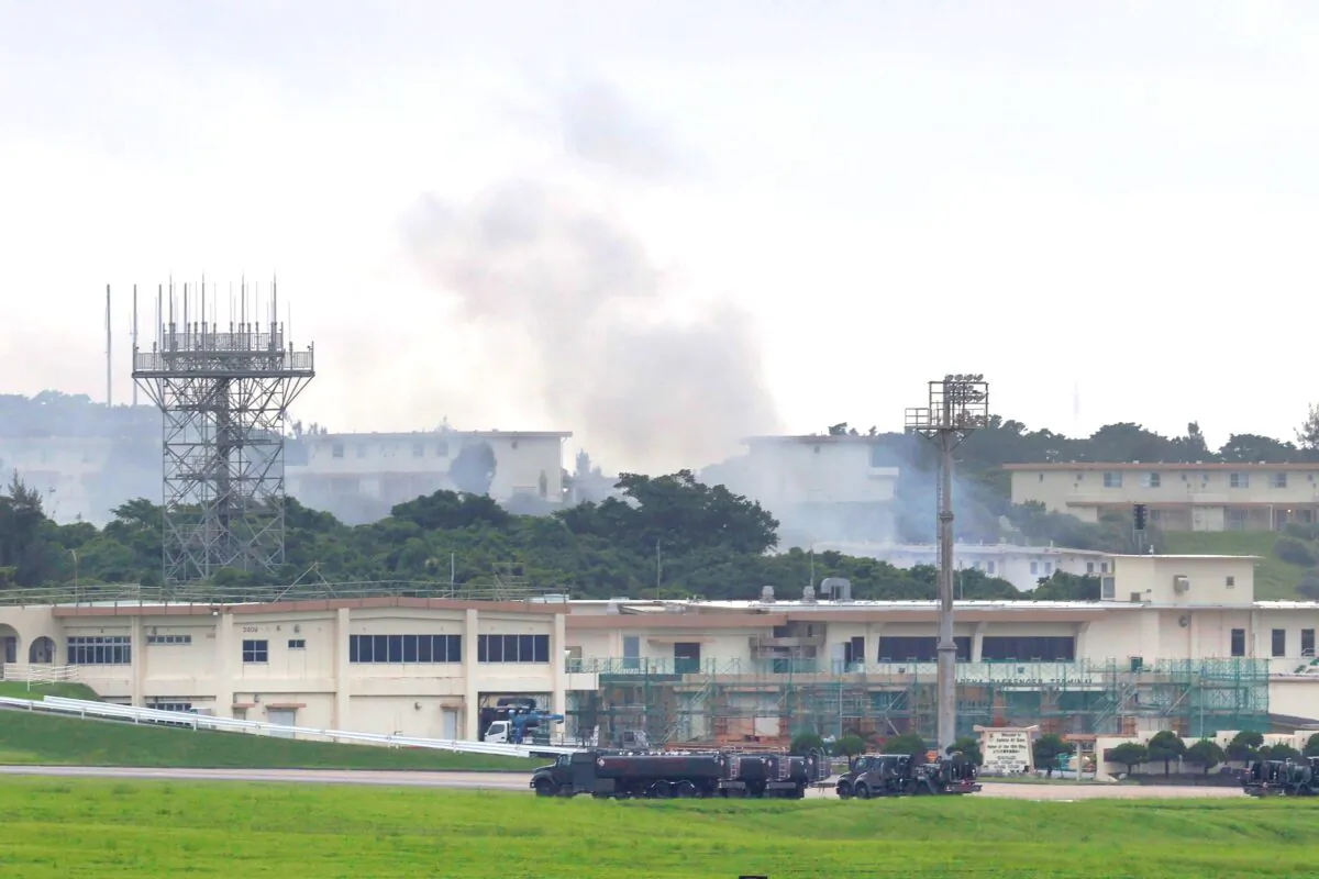 Smoke rises from at the 18th Wing Hazardous Materials Pharmacy building at Kadena Air Base during a fire on Okinawa island, Japan,on June 22, 2020. (Kyodo News via AP)