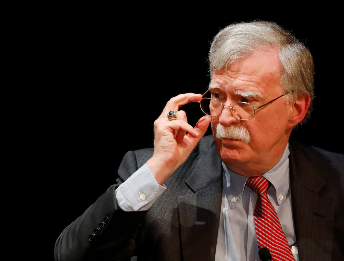 Former U.S. national security adviser John Bolton adjusts his glasses during his lecture at Duke University in Durham, N.C., on Feb. 17, 2020. (Jonathan Drake/Reuters)