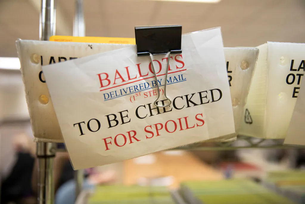 Mailed-in ballots sit in U.S. Postal Service bins at the office of the Stanislaus County Clerk in Modesto, Calif., on Nov. 6, 2018. (Alex Edelman/Getty Images)