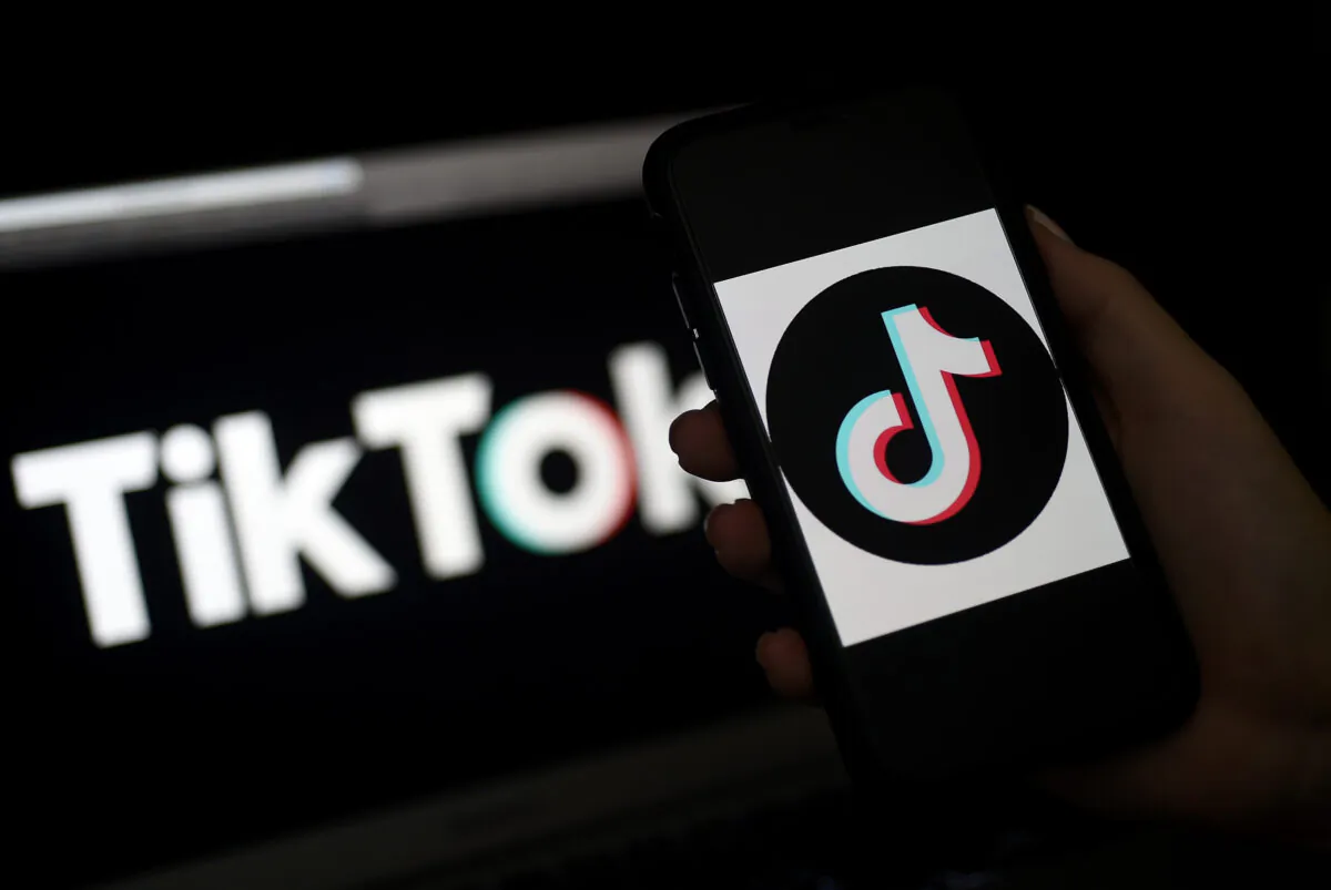 The logo of social media application TikTok is displayed on the screen of an iPhone in Arlington, Va., on April 13, 2020. (OLIVIER DOULIERY/AFP via Getty Images)