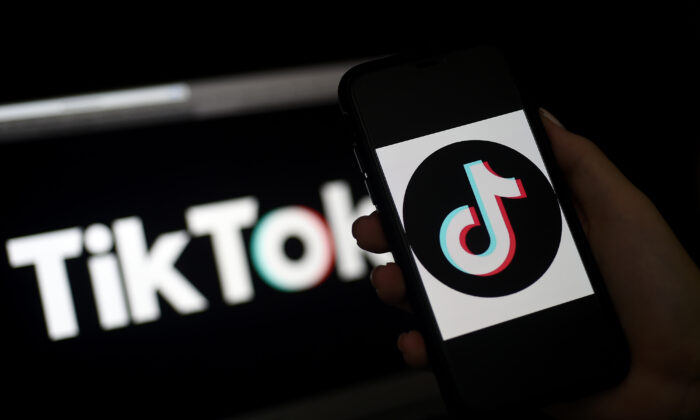 TikTok is displayed on the screen of an iPhone in Arlington, Virginia, on April 13, 2020. (OLIVIER DOULIERY/AFP via Getty Images)
