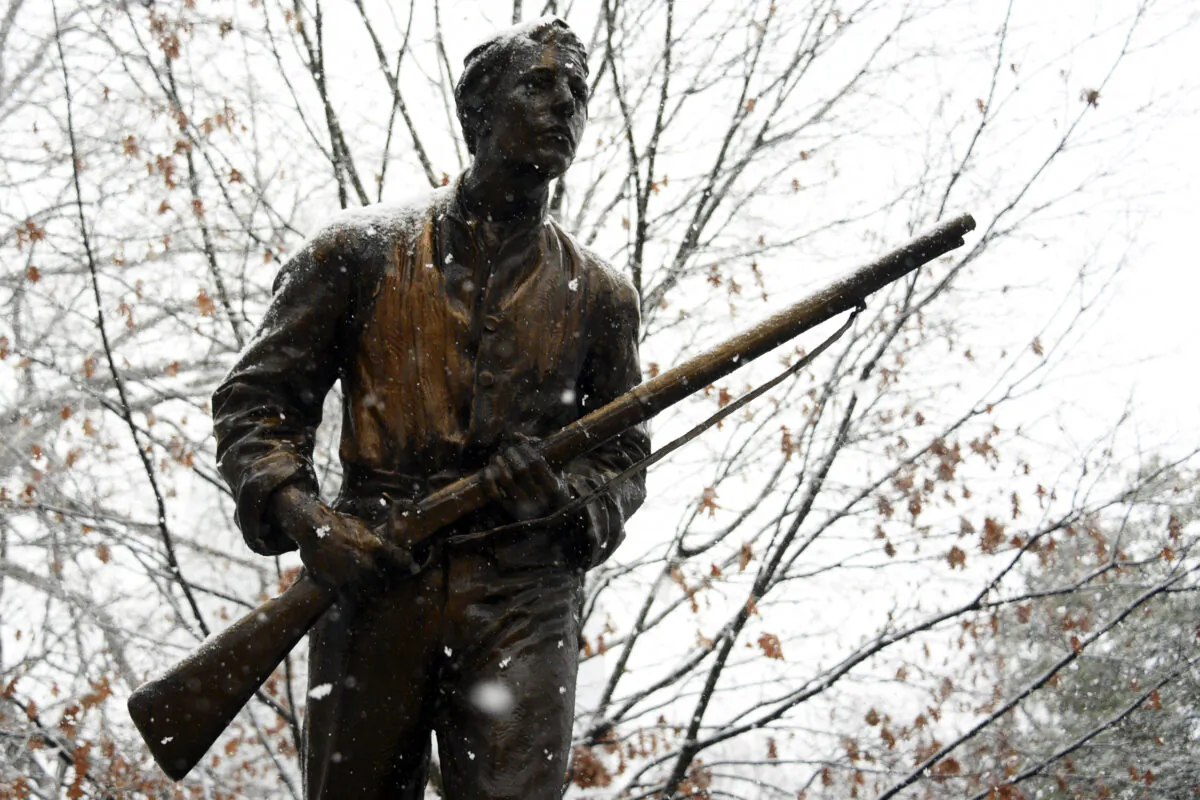 Snow falls on the Henry Lawson Wyatt Monument at the state capitol in Raleigh, North Carolina, on Jan. 17, 2018. (Lance King/Getty Images)