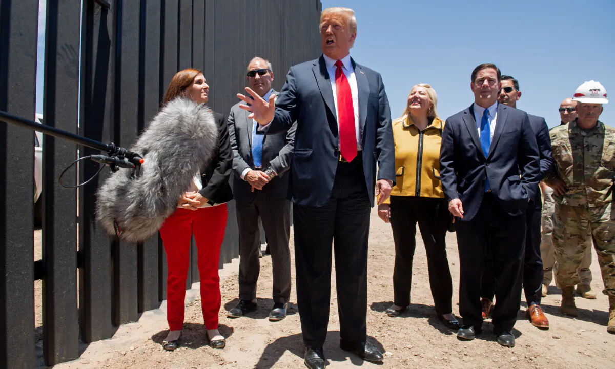 President Donald Trump speaks to the media as he participates in a ceremony commemorating the 200th mile of border wall at the international border with Mexico in San Luis, Arizona, on June 23, 2020. (Saul Loeb/AFP via Getty Images)