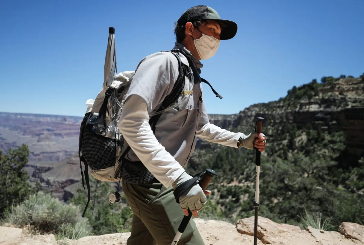 A park ranger wears a face mask while patrolling the Bright Angel trail in the South Rim of Grand Canyon National Park, which has partially reopened on weekends, in Grand Canyon National Park, Ariz., on May 25, 2020. (Mario Tama/Getty Images)