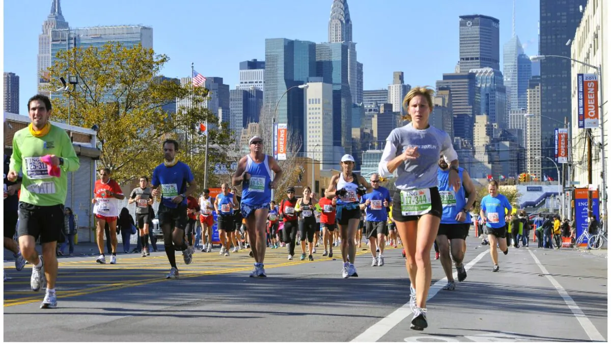 Runners make their way down 44th Drive in the Queens borough of New York during the New York City Marathon on Nov. 6, 2011. (Kathy Kmonicek/AP Photo)