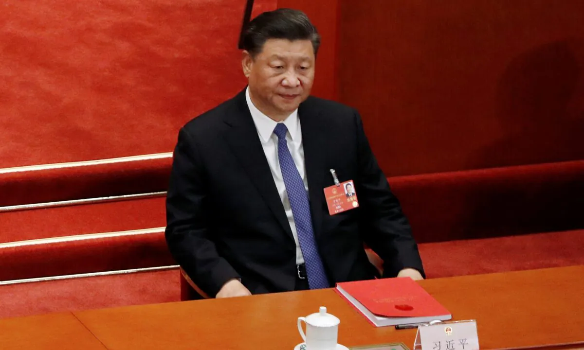 Chinese leader Xi Jinping attends the closing session of the National People's Congress at the Great Hall of the People in Beijing, China, on May 28, 2020. (Carlos Garcia Rawlins/Reuters)