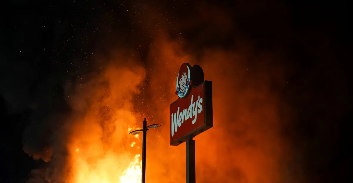 A Wendy’s burns following a rally in the wake of the police shooting death of Rayshard Brooks, in Atlanta, Ga., June 13, 2020. (Elijah Nouvelage/Reuters)