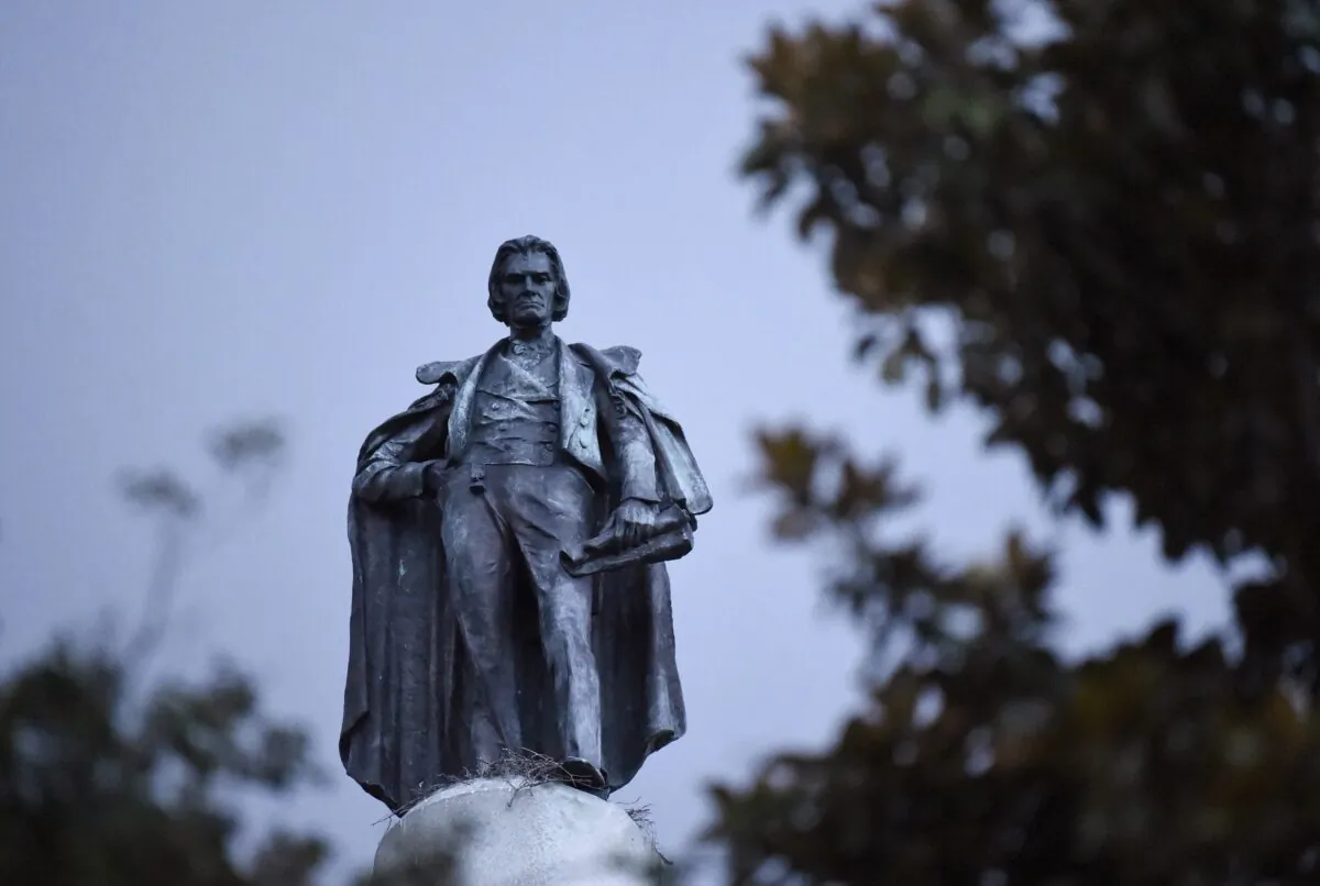 A 100-foot monument to former U.S. vice president and slavery advocate John C. Calhoun towers over a downtown square in Charleston, S.C., on June 23, 2020. (Meg Kinnard/AP Photo)