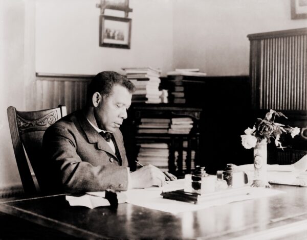 Booker T. Washington at desk