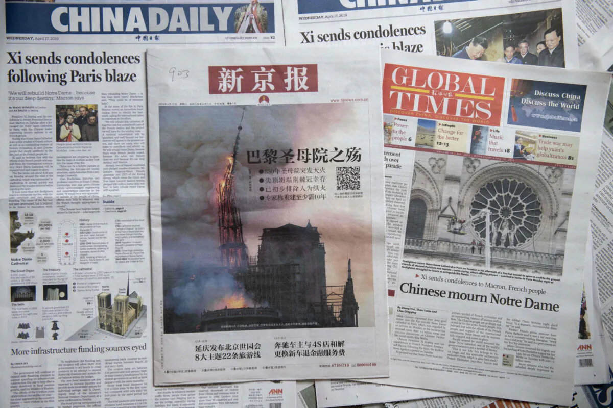 Front pages of the China Daily (L), the Beijing News (C) and the Global Times (R) in Beijing on April 17, 2019. (Nicolas Asfouri/AFP via Getty Images)