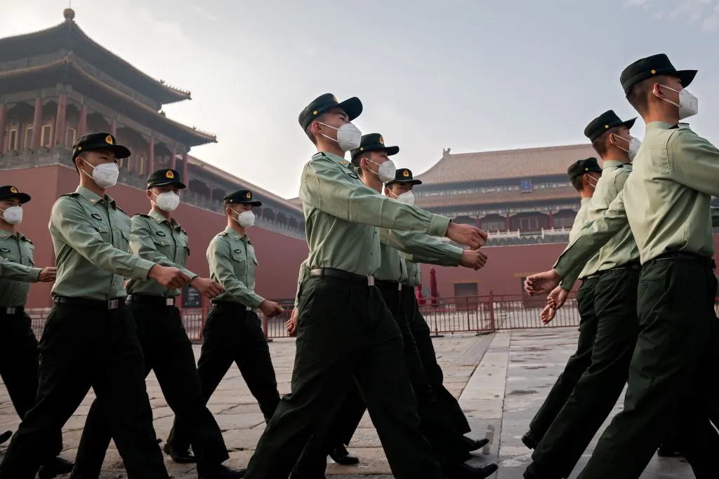 People's Liberation Army (PLA) soldiers march next to the entrance to the Forbidden City during the opening ceremony of the Chinese People's Political Consultative Conference (CPPCC) in Beijing on May 21, 2020. (Nicolas Asfouri/AFP via Getty Images)