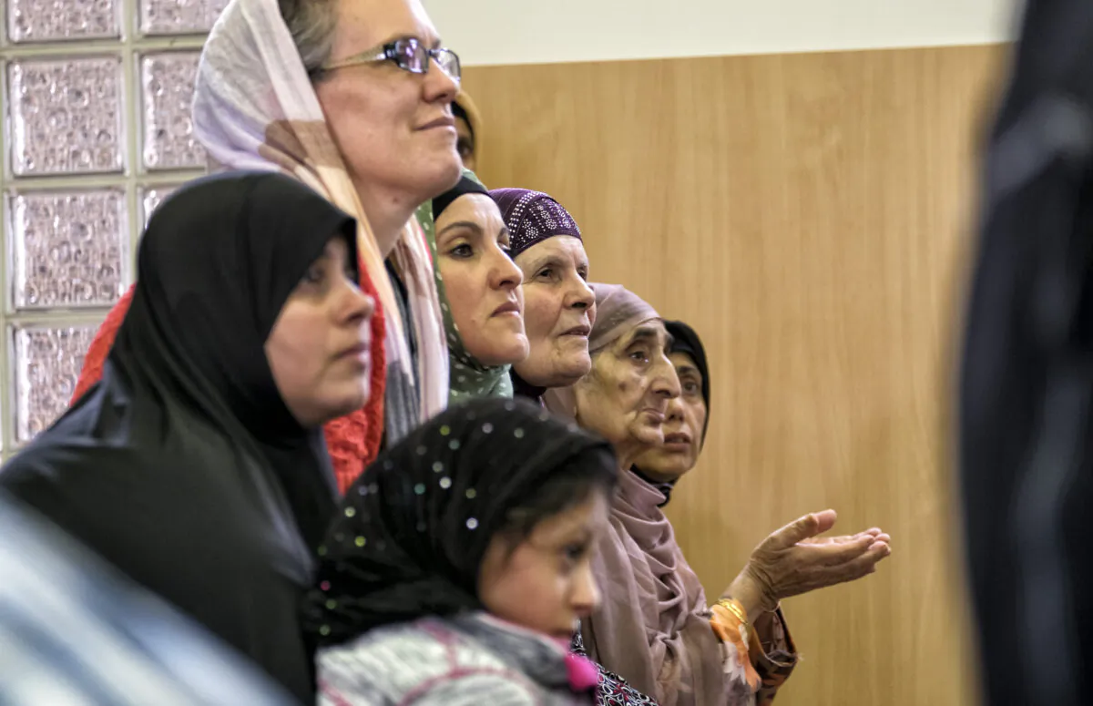 Women listen to a local Imam during National Mosque open day at the Werribee Islamic Centre in the suburb of  Hoppers Crossing in Melbourne, Australia on October 25, 2014. (Luis Ascui/Getty Images)