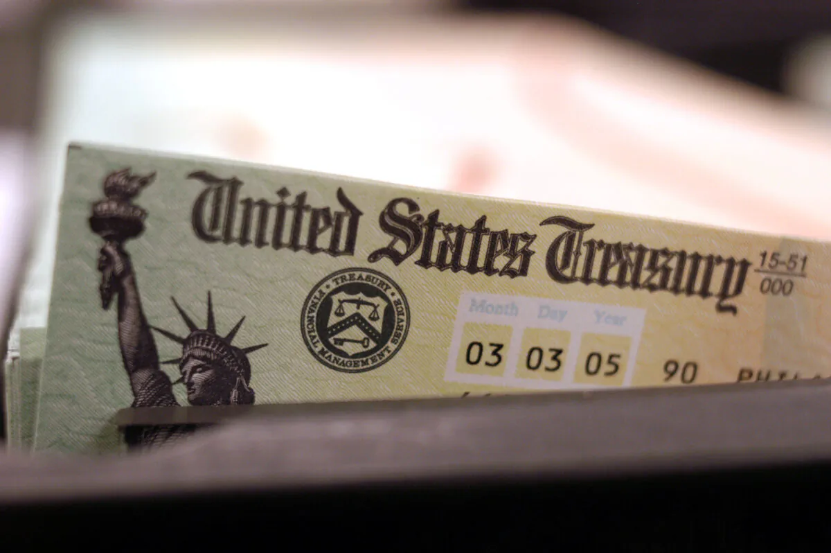 Blank Social Security checks are run through a printer at the U.S. Treasury printing facility in Philadelphia, Penn., on Feb. 11, 2005. (William Thomas Cain/Getty Images)