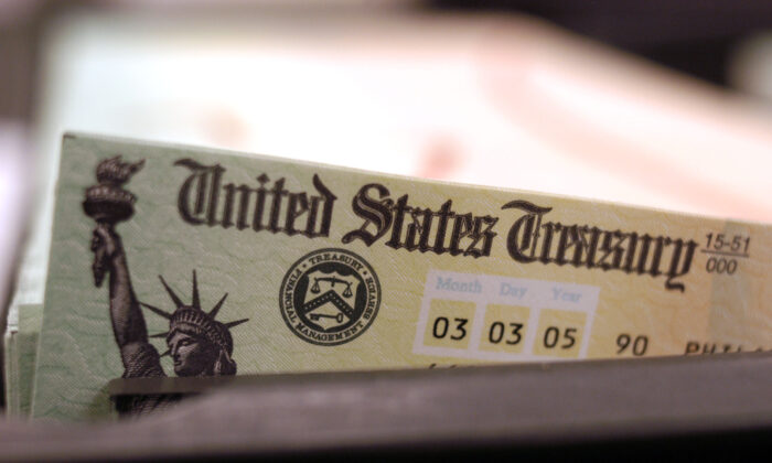 Blank Social Security checks are run through a printer at the U.S. Treasury printing facility in Philadelphia, Penn., on Feb. 11, 2005. (William Thomas Cain/Getty Images)
