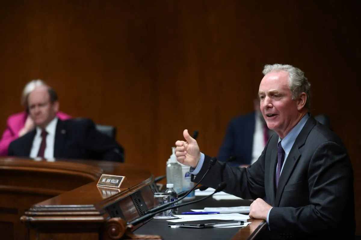 Sen. Chris Van Hollen (D-Md.) speaks to Ajit Pai, Chairman of the Federal Communications Commission, during an oversight hearing to examine the Federal Communications Commission spectrum auctions program for fiscal year 2021, on Capitol Hill in Washington, on June 16, 2020. (Toni Sandys/Reuters)