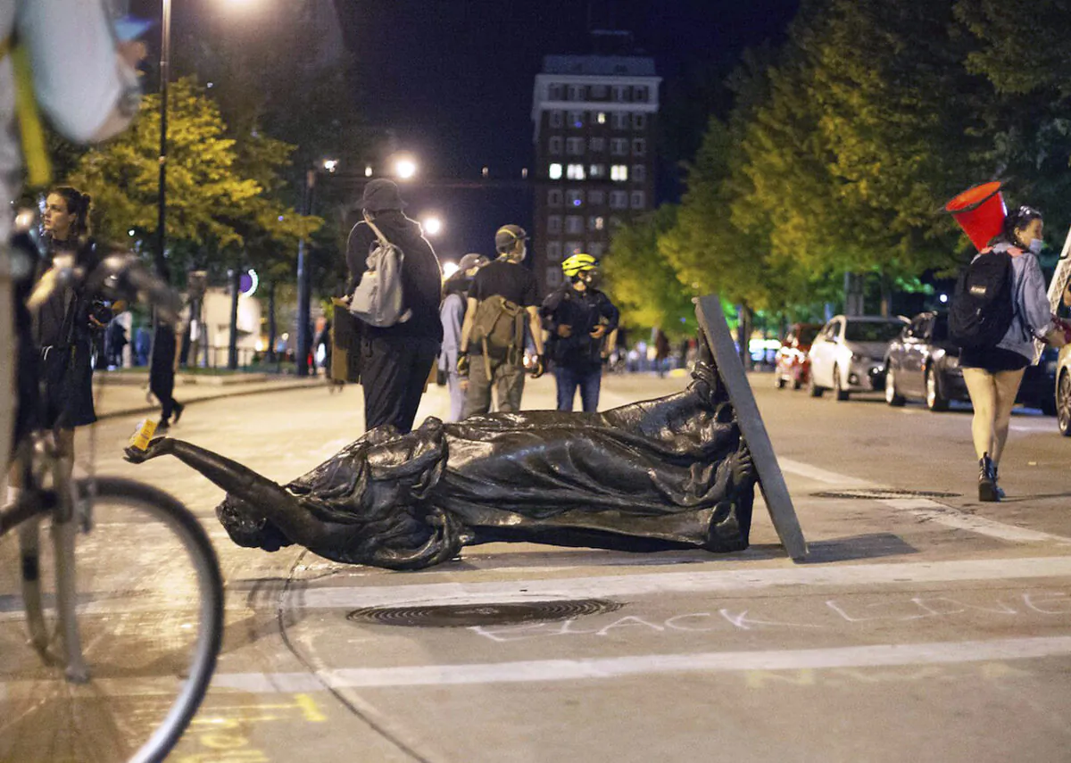 Wisconsin's 'Forward' statue lies in the street on Capitol Square in Madison, Wis., on June 23, 2020. (AP Photo/Emily Hamer, Wisconsin State Journal)