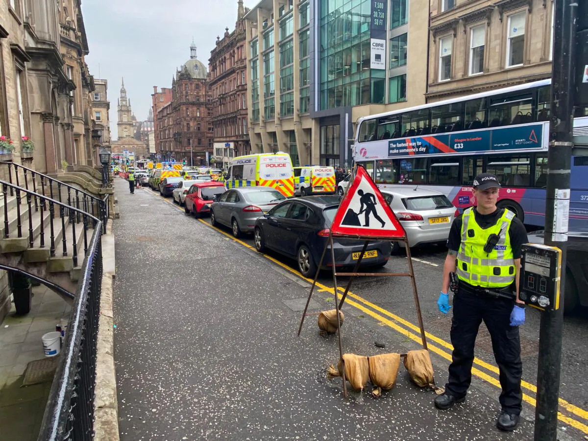 In this picture obtained from social media, emergency responders are seen near a scene of reported stabbings, in Glasgow, Scotland, Britain, on June 26, 2020. (@JATV_Scotland/via Reuters)