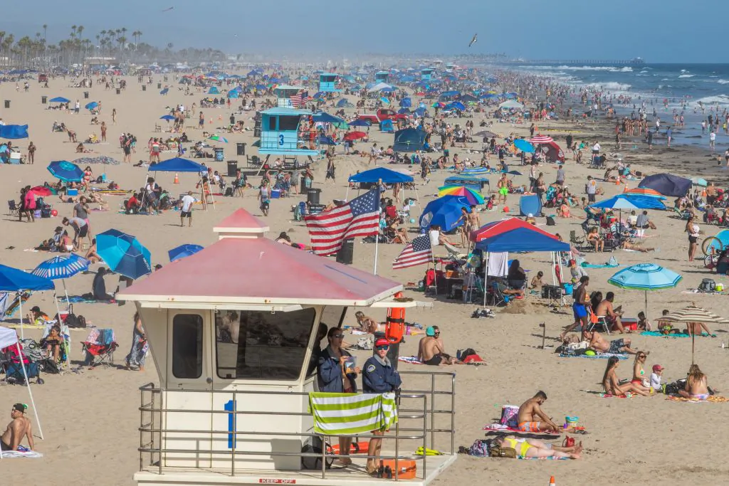 People enjoy one of Orange County's most popular beaches amid the COVID-19 pandemic in Huntington Beach, Calif., on June 14, 2020. (Apu Gomes/AFP via Getty Images)