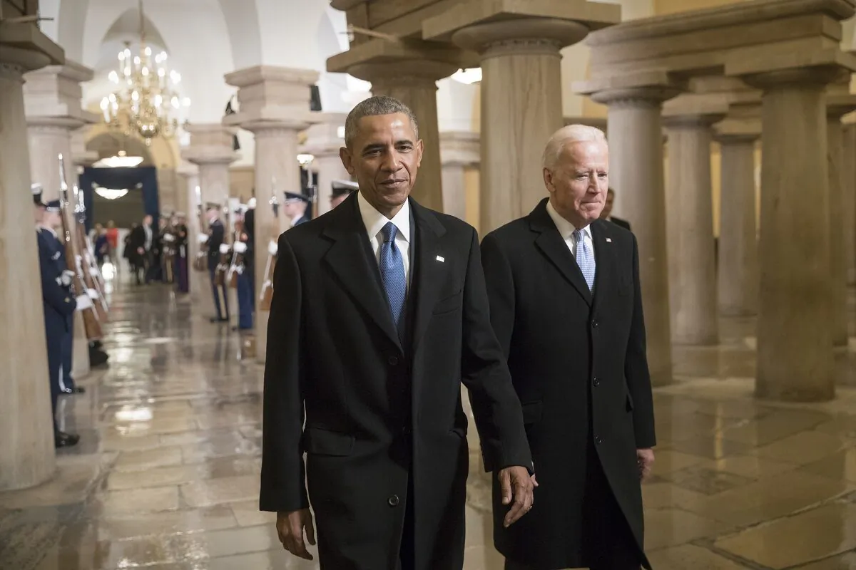 President Barack Obama and Vice President Joe Biden walk through the Crypt of the Capitol for Donald Trump's inauguration ceremony, in Washington on Jan. 20, 2017. (J. Scott Applewhite/Getty Images)