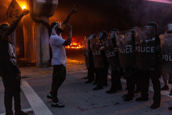 Protesters confronts riot police
