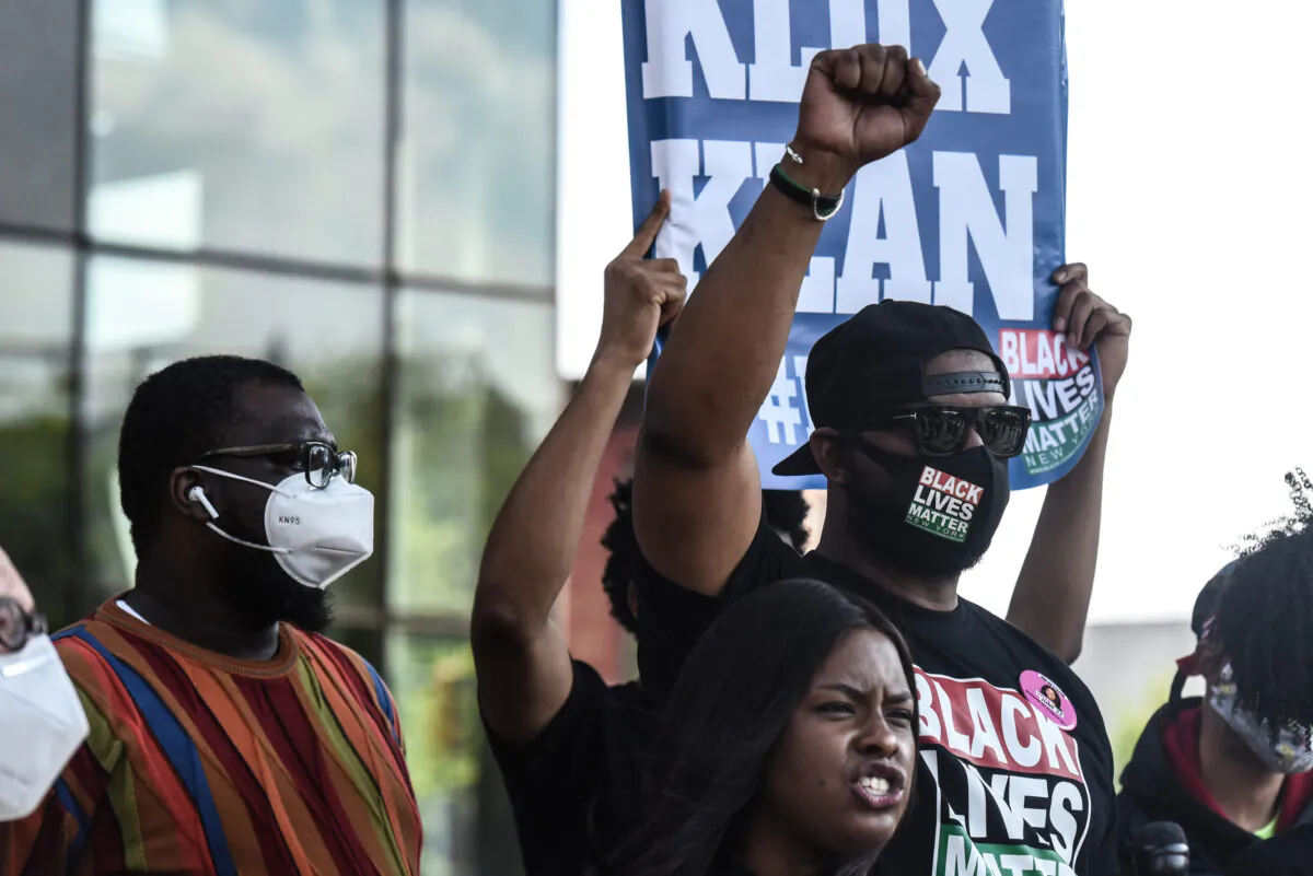 Hawk Newsome (R) holds his fist up at a rally in Brooklyn, New York City, on May 15, 2020. (Stephanie Keith/Getty Images)
