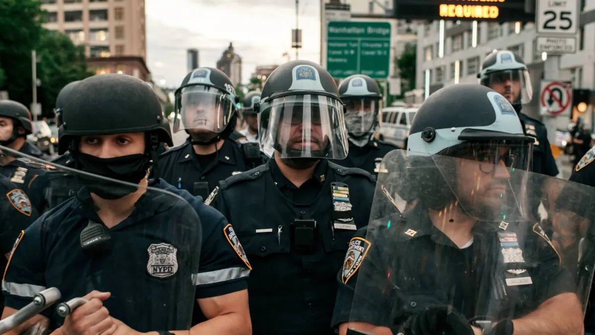 NYPD officers block the entrance of the Manhattan Bridge as hundreds protesting alleged police brutality and systemic racism attempt to cross into the borough of Manhattan from Brooklyn after a citywide curfew went into effect in New York City on June 2, 2020. (Scott Heins/Getty Images)