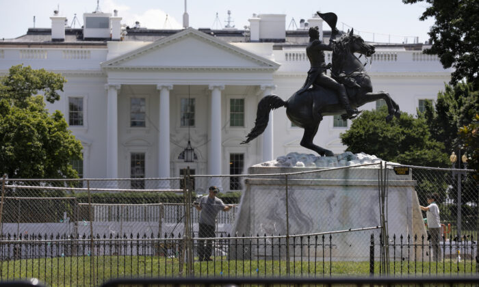 The base of the statue of former president Andrew Jackson is power washed inside a newly closed Lafayette Park, in Washington, on June 24, 2020. (Jacquelyn Martin/AP Photo)