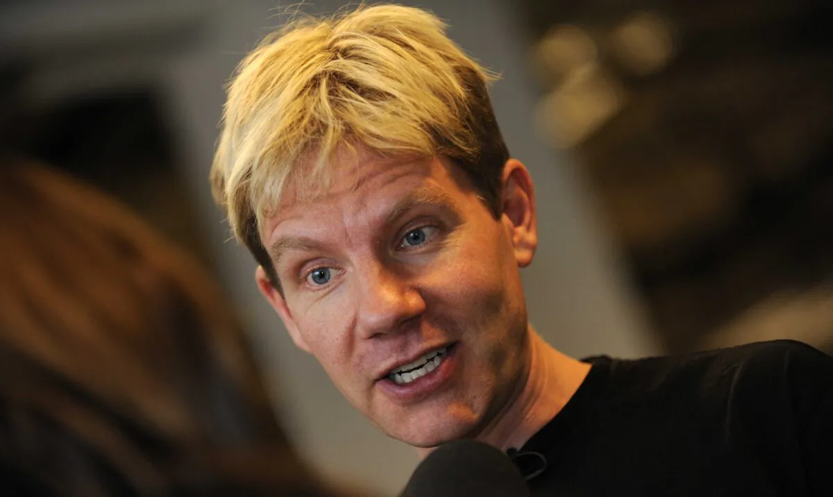 Danish professor Bjorn Lomborg speaks with a journalist at the Bella center of Copenhagen on Dec. 15, 2009, the 9th day of the COP15 U.N. Climate Change Conference. (Adrian Dennis/AFP via Getty Images)