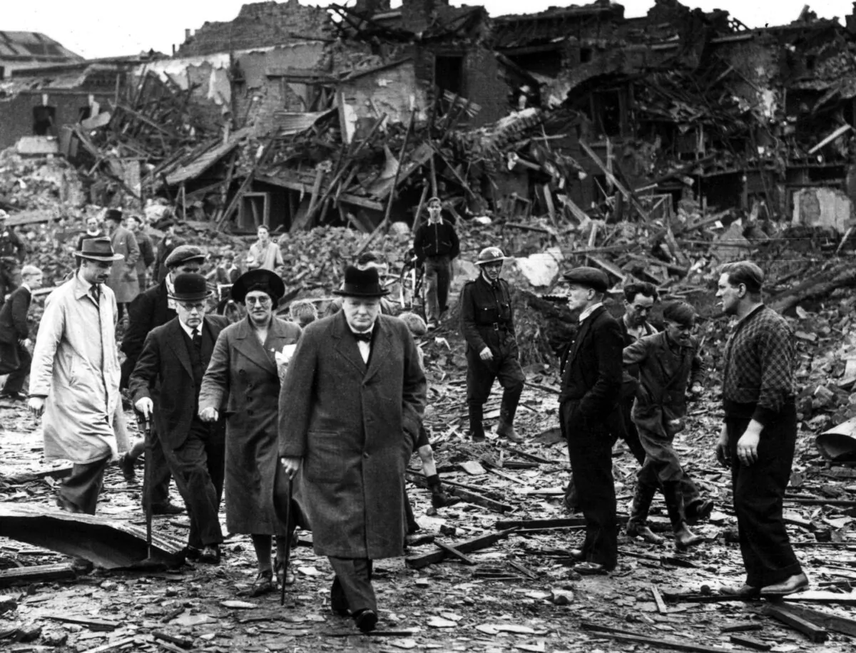 Prime Minister Winston Churchill inspects air raid damage in Battersea, south London, on Sept. 10, 1940. (Reg Speller/Fox Photos/Getty Images)