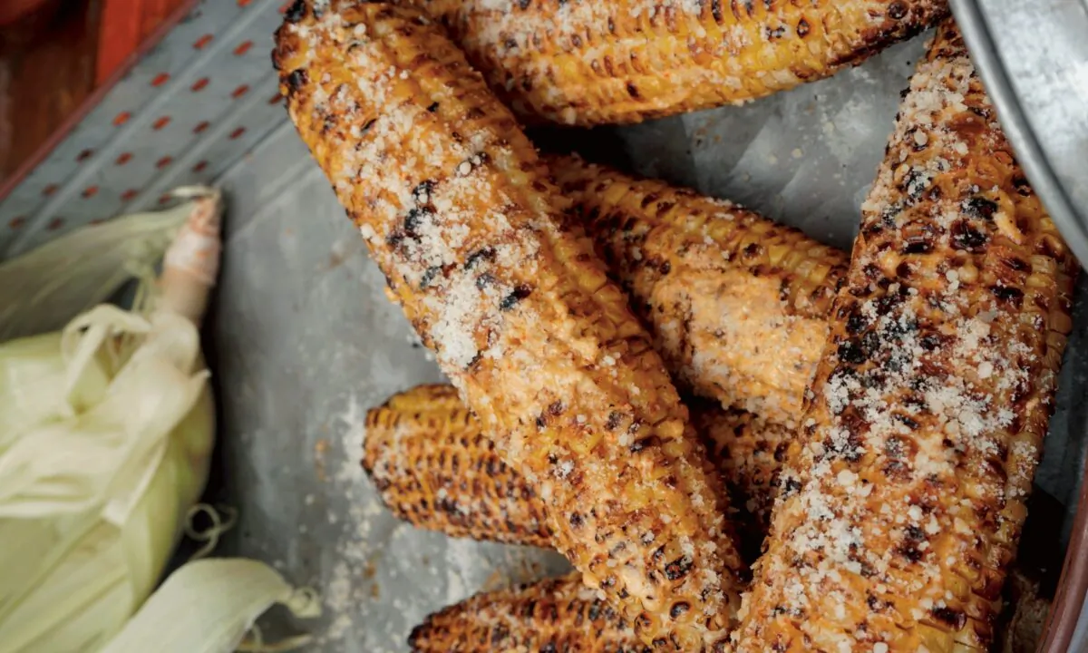 The star of this Mexican-inspired grilled corn is the spread, a mix of sour cream, mayo, spices, and cheese. (Photo by Shannon Rollins)