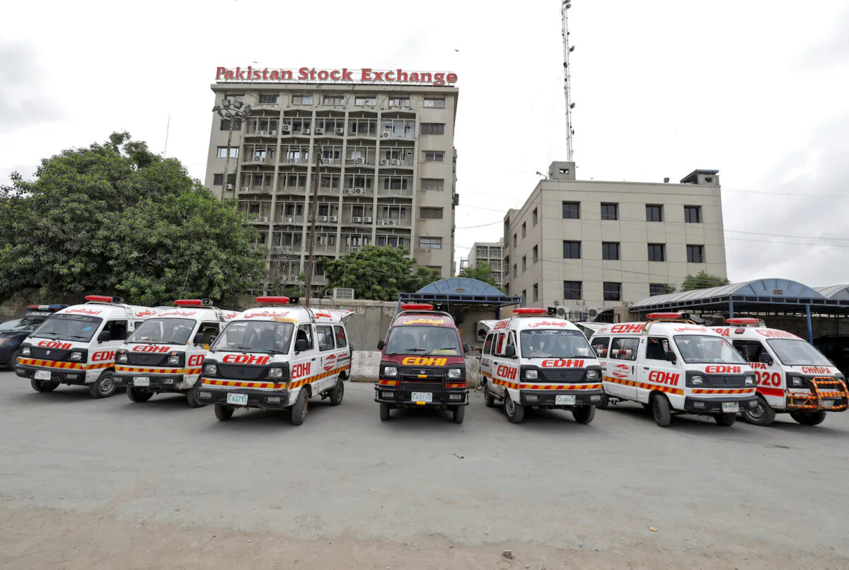 Ambulances are seen parked outside Pakistan Stock Exchange building after an attack in Karachi on June 29, 2020. (Akhtar Soomro/Reuters)