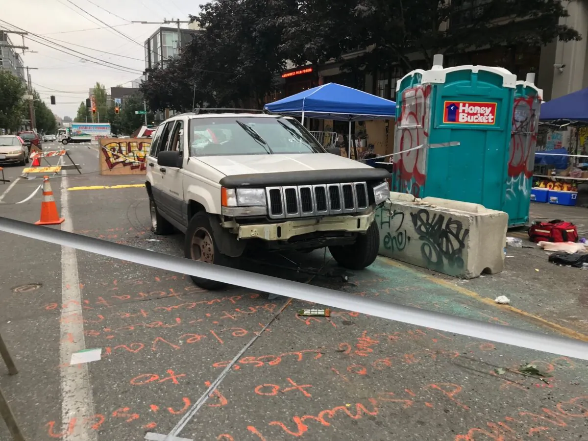 A car sits in the Capitol Hill Organized Protest zone following a shooting in Seattle on June 29, 2020. (Aron Ranen/AP Photo)