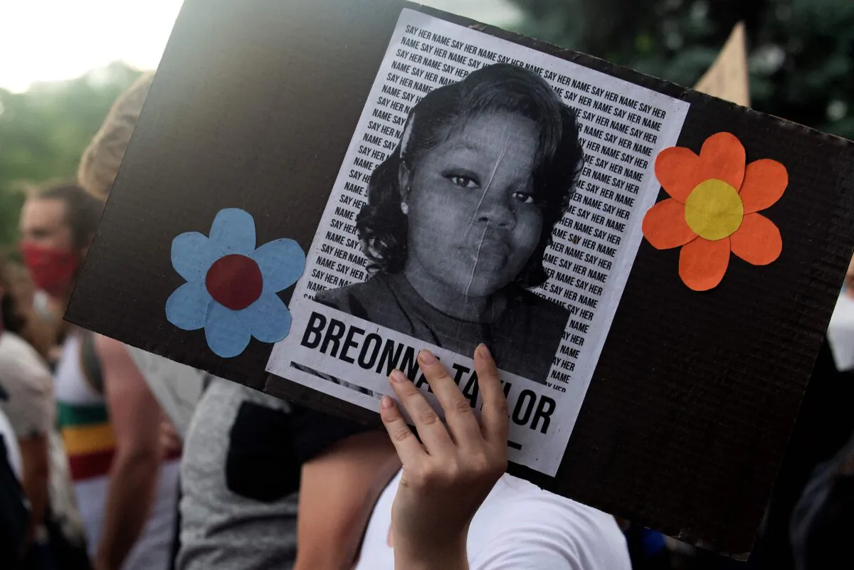 A demonstrator holds a sign with the image of Breonna Taylor in Denver, Colo., on June 3, 2020. (Jason Connolly/AFP via Getty Images)