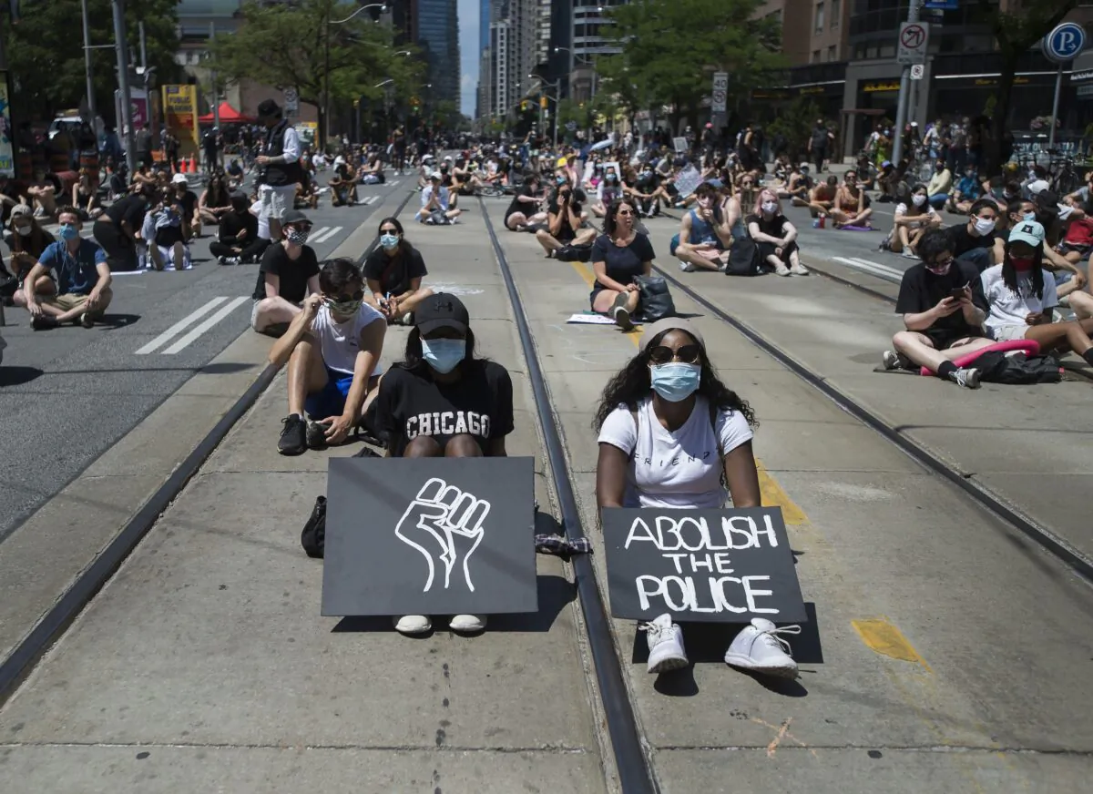 Thousands of people protest in support of Black Lives Matter in Toronto on June 19, 2020. (Nathan Denette/The Canadian Press)