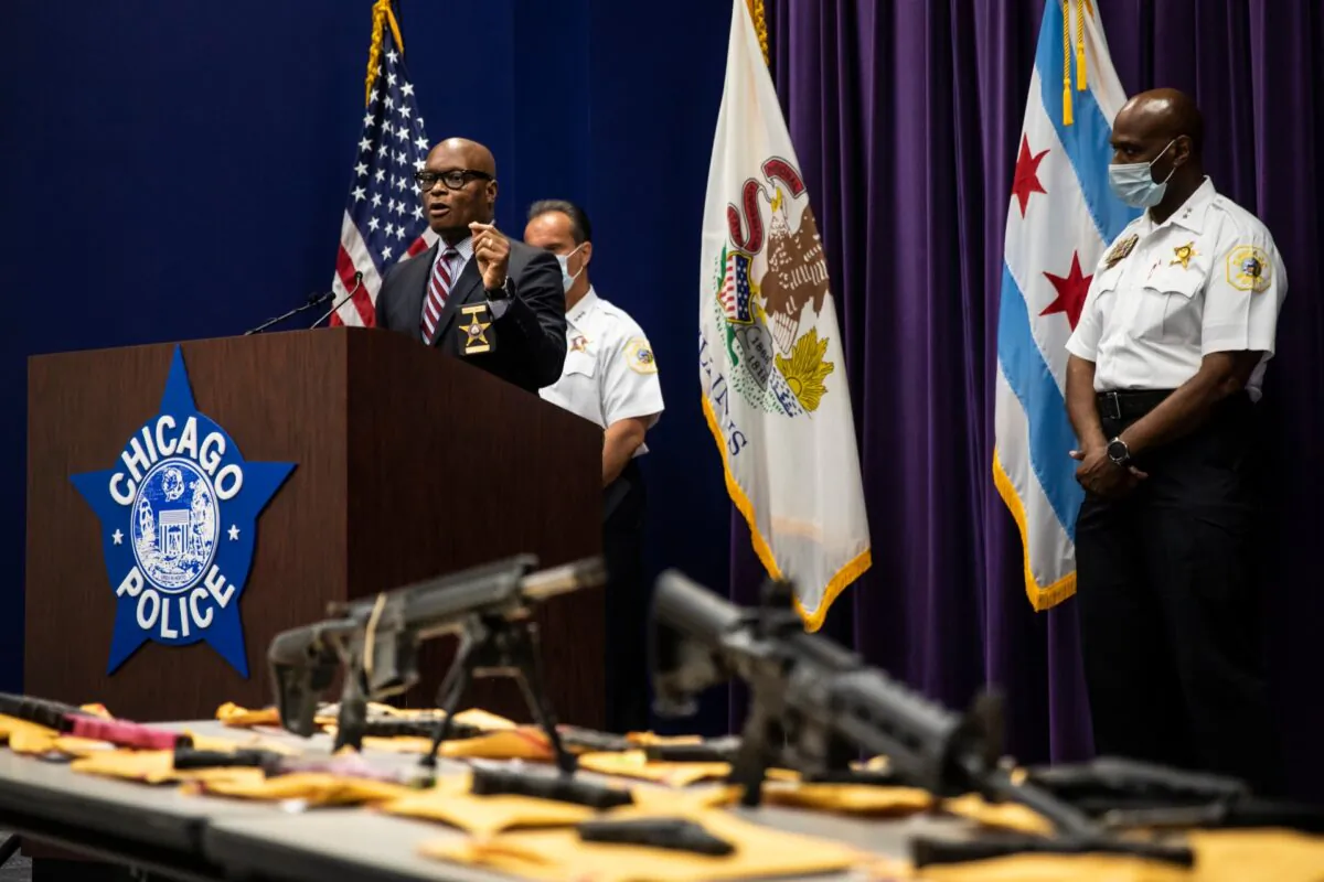 Chicago Police Supt. David Brown gestures toward a table of guns allegedly confiscated by Chicago police officers over the weekend during a news conference at CPD headquarters, on June 29, 2020. (Ashlee Rezin Garcia/Chicago Sun-Times/AP)