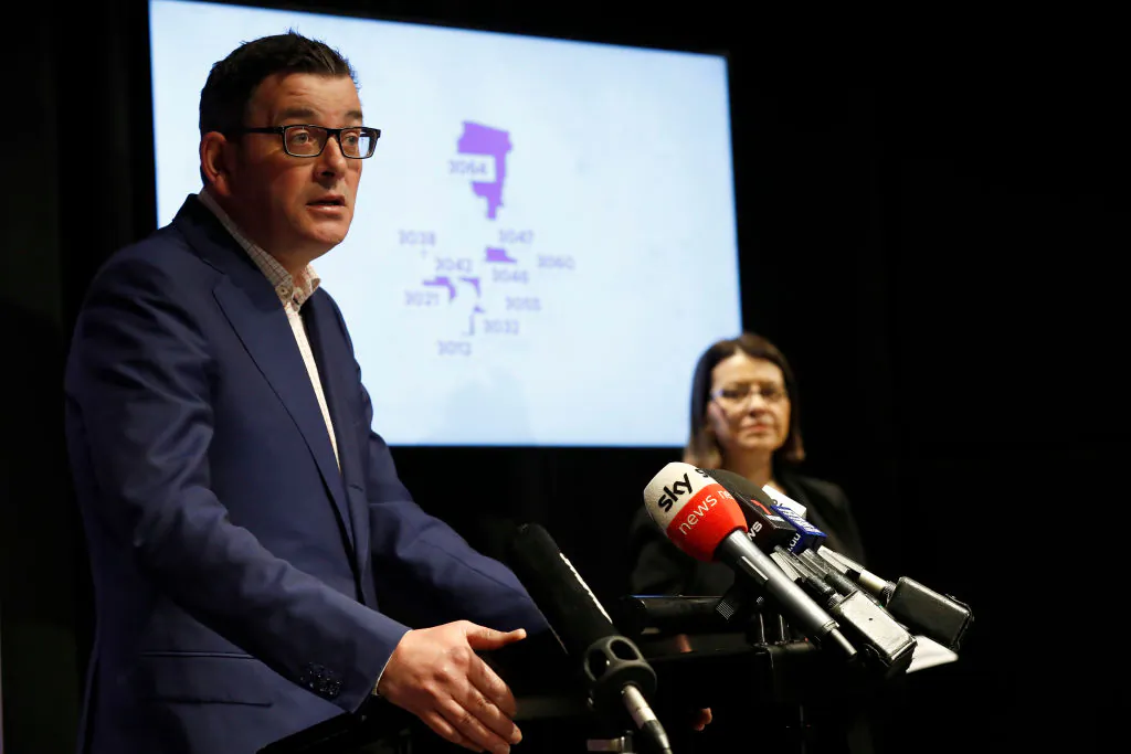 Victorian premier Daniel Andrews speaks to the media on June 30, 2020 in Melbourne, Australia. A graphic displaying 10 Melbourne post codes that will required to go to further restrictions at midnight on July 1st. (Darrian Traynor/Getty Images)