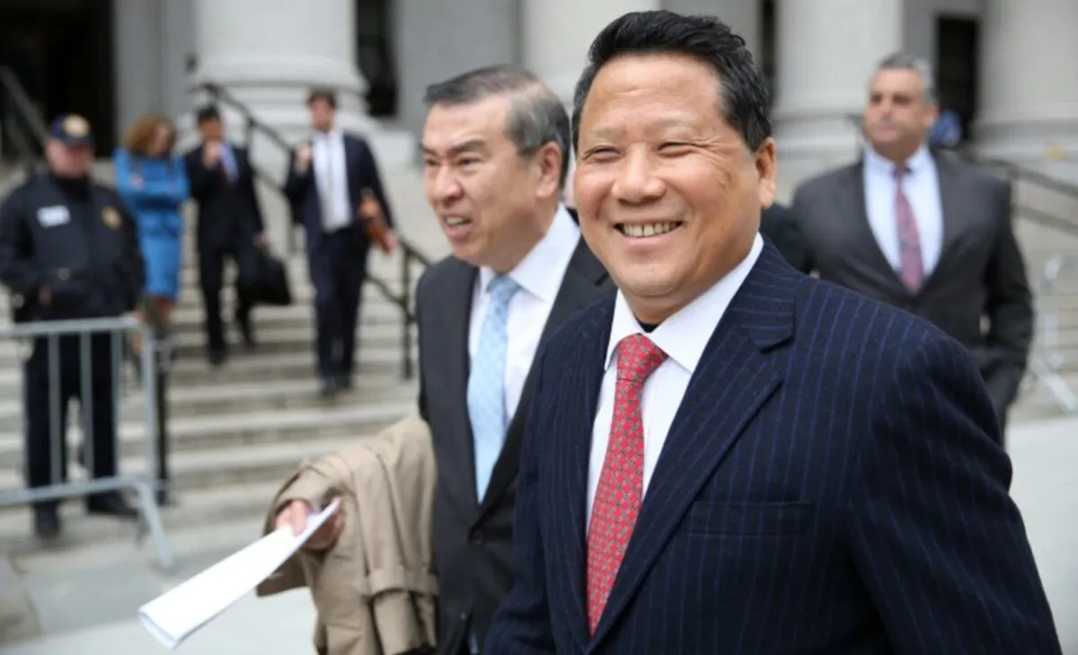 Macau billionaire real estate developer Ng Lap Seng (R), accused of bribing former United Nations General Assembly President John Ashe, exits the Manhattan U.S. District Courthouse in New York, on April 7, 2017. (Ashlee Espinal/Reuters)