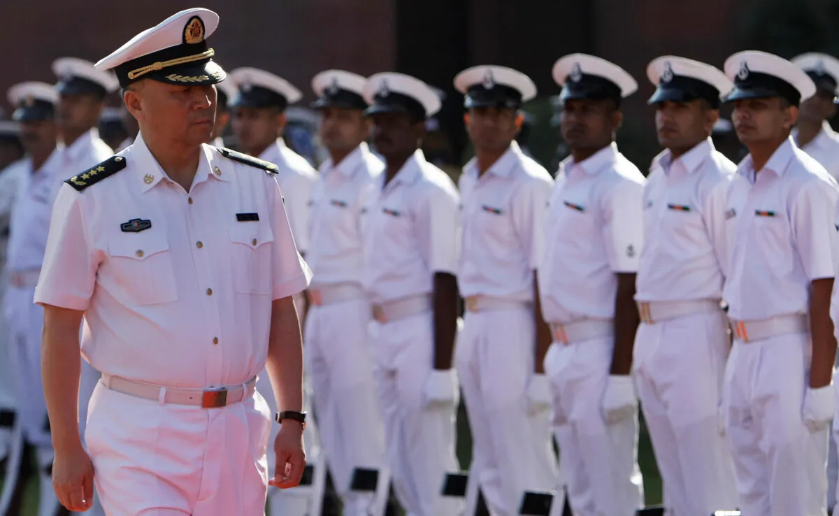Chinese People's Liberation Army (PLA) Navy Commander Wu Shengli (L) inspects a guard of honor in New Delhi, India, on Nov. 3, 2008. (Manan Vatsyayana/AFP via Getty Images)