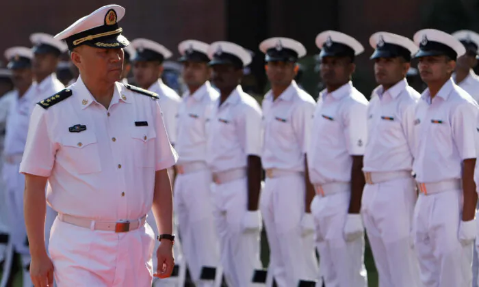 Chinese People's Liberation Army (PLA) Navy Commander Wu Shengli (L) inspects a guard of honor in New Delhi, India, on Nov. 3, 2008. (Manan Vatsyayana/AFP via Getty Images)
