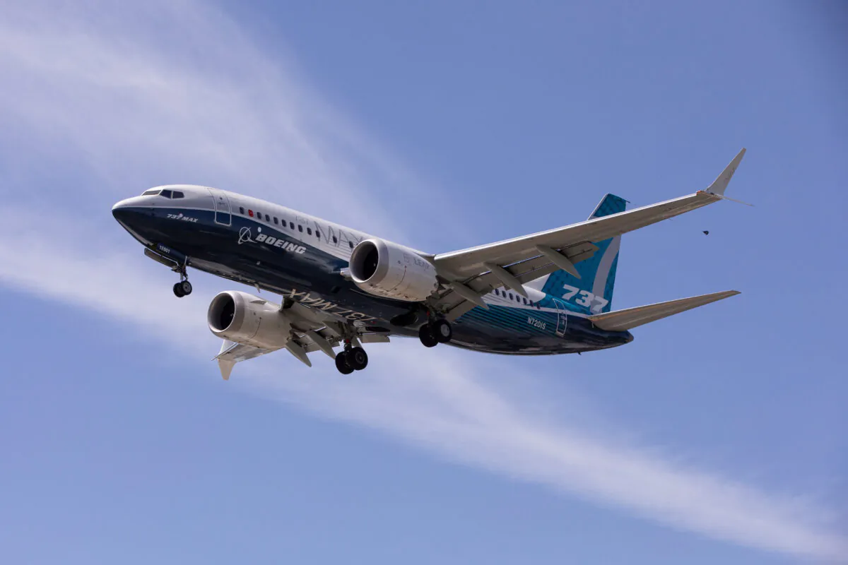 A Boeing 737 MAX airplane lands after a test flight at Boeing Field in Seattle, Washington on June 29, 2020. (Karen Ducey?Reuters)
