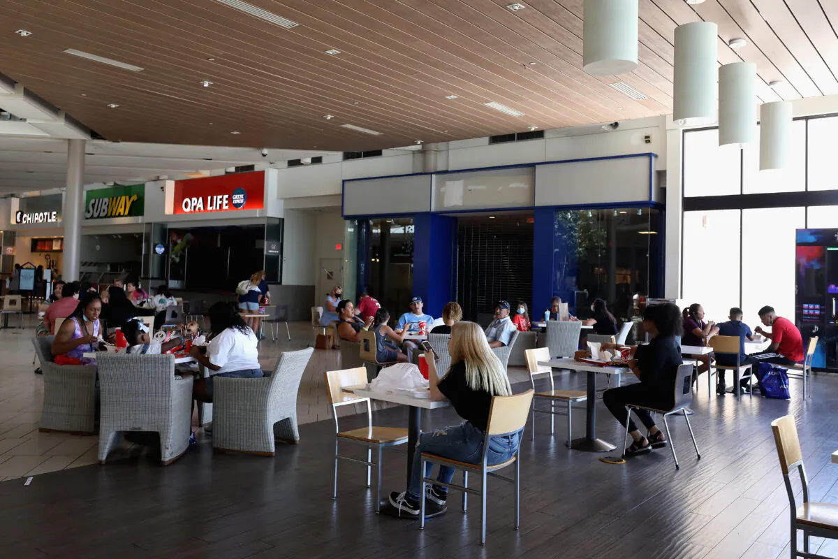 Consumers sit in the food court as they return to retail shopping at the Arrowhead Towne Center in Glendale, Ariz., on June 20, 2020. (Christian Petersen/Getty Images)