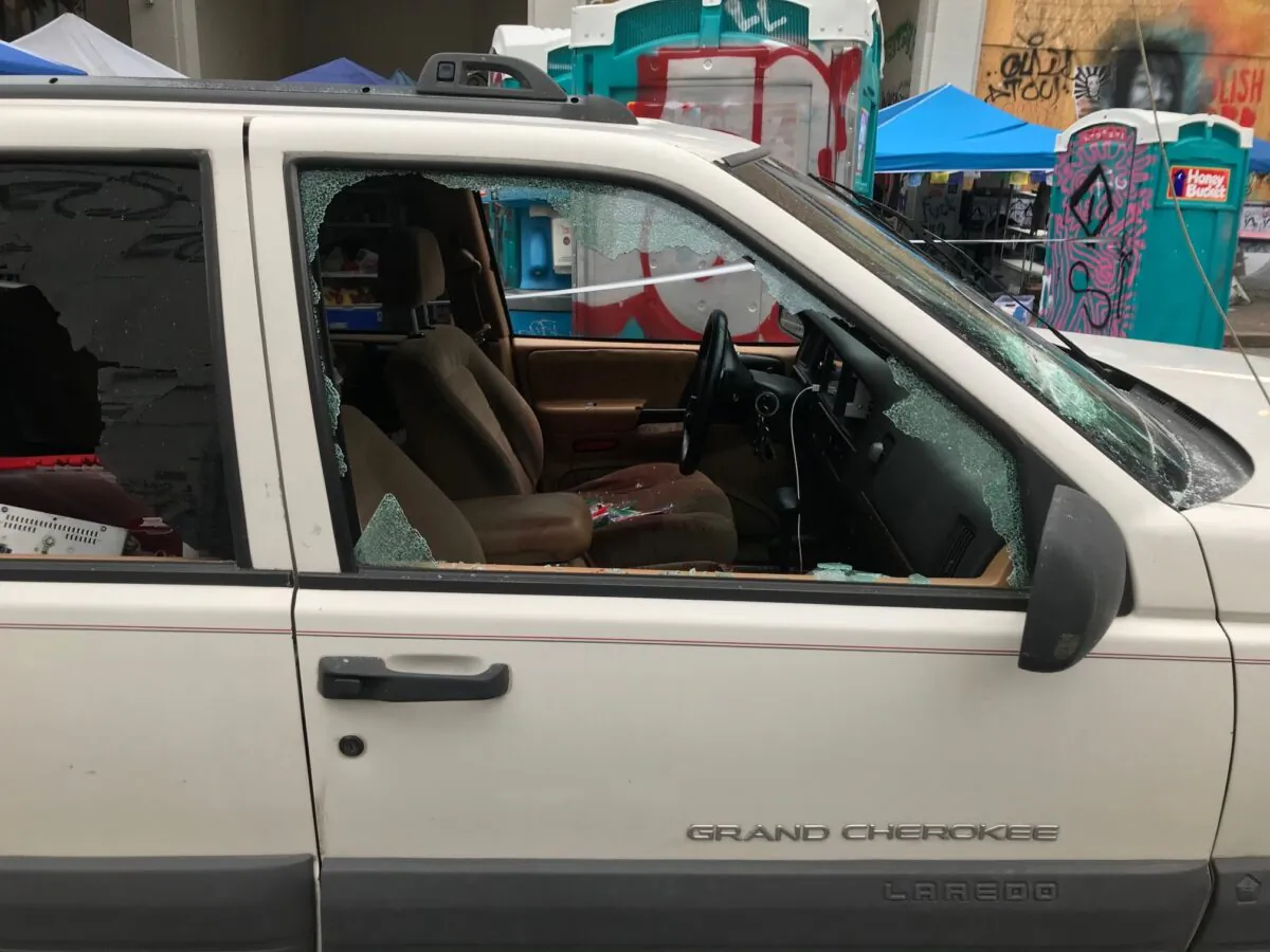 A car sits in the Capitol Hill Organized Protest zone following a shooting in Seattle, Wash., early on June 29, 2020. (Aron Ranen/AP Photo)