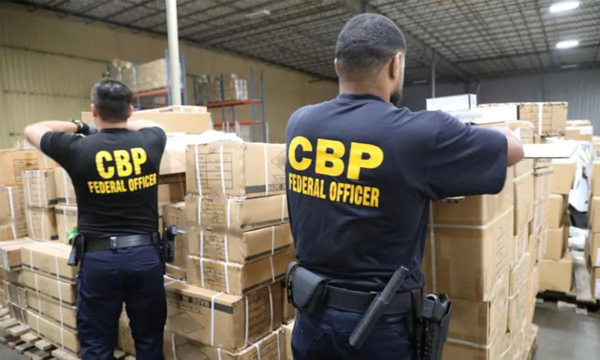 U.S. Customs and Border Protection (CBP) officers inspect shipment of hair products from China at the port of New York/Newark on July 1, 2020. (CBP)