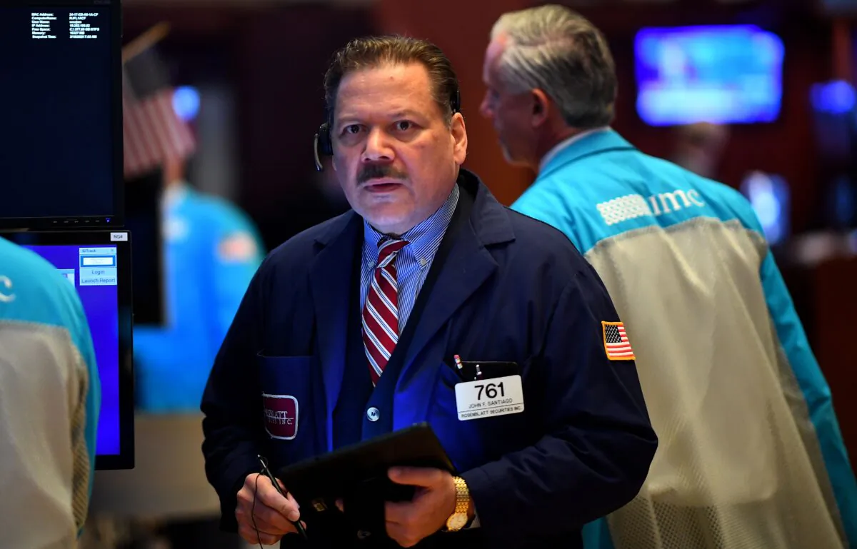 Traders work during the opening bell at the New York Stock Exchange (NYSE) at Wall Street in New York City, U.S. on March 19, 2020. (Johannes Eisele/AFP via Getty Images)